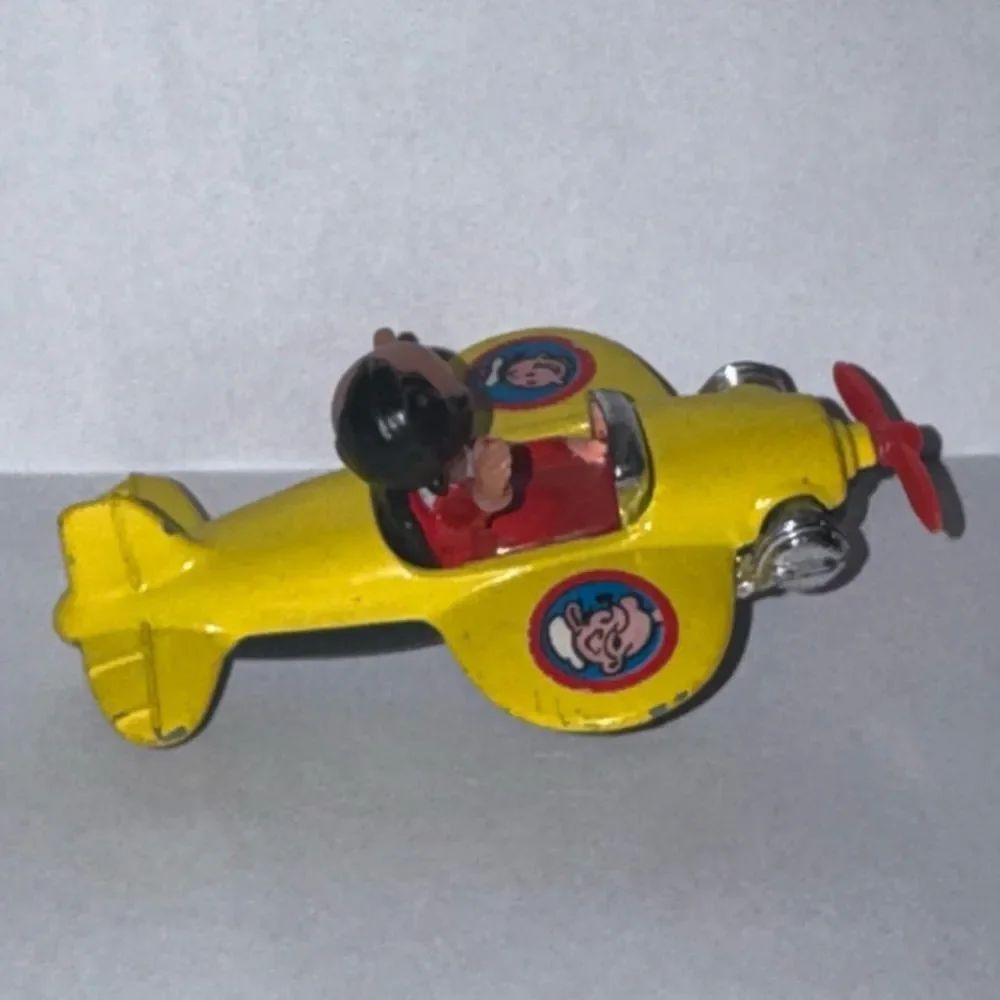 vintage 1980 Corgi Juniors Olive Oyl yellow airplane from the Popeye cartoon